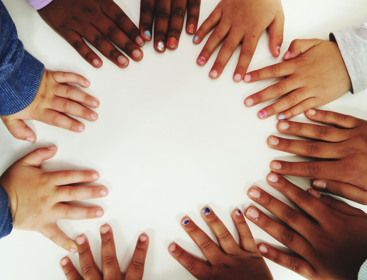 Hands forming unity circle